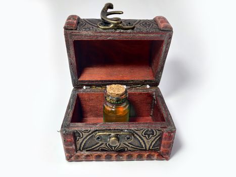 Wood chest with potion orange. old treasure casket isolated on white background. Alchemy set with flasks. small glass bottles with colored liquid for game role play. magic potions.