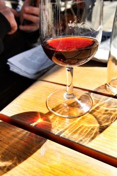Glass of port wine tawny on a table