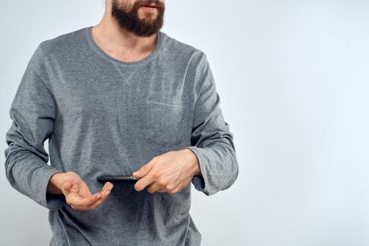Man with tablet in hands technology internet lifestyle confident cropped view