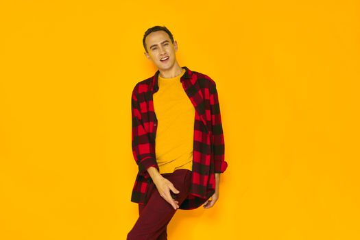 man in shirt and yellow T-shirt on an isolated background