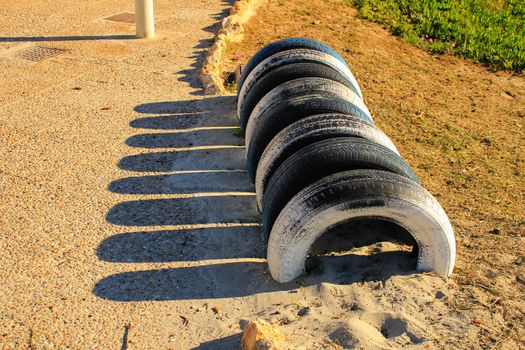 Ecological bicycle parking made with tires on the beach
