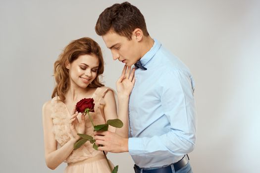 Man and woman with red rose romance love family couple holiday. High quality photo