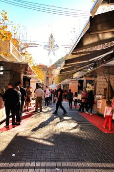 Jijona, Alicante, Spain- December 9, 2018: People walking and buying traditional nougat at the Jijona Christmas Fair