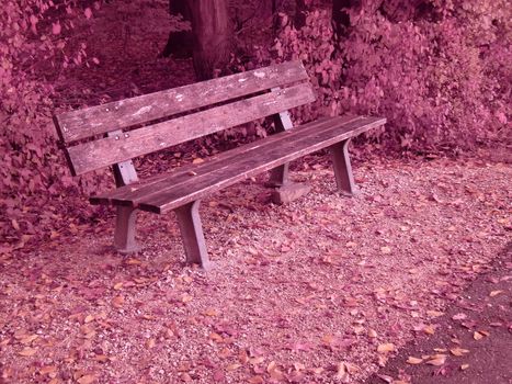 Infrared photo of a park bench in autumn with Swabian Alb in Germany