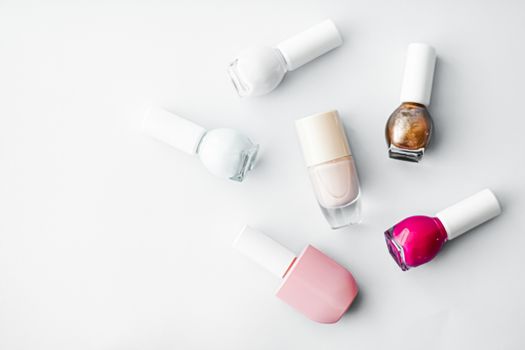Nail polish bottles on white background, beauty brand