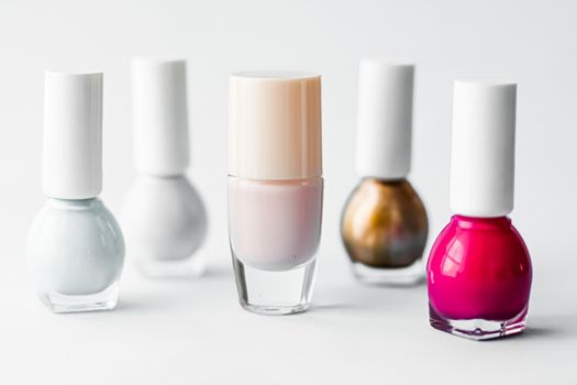 Nail polish bottles on white background, beauty brand