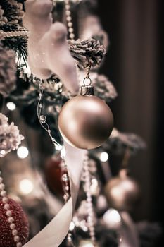 Christmas tree decorations, baubles, bows and garlands as festiv