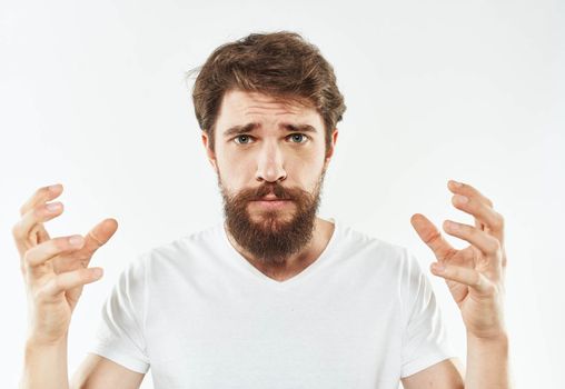 Portrait of a man emotions white t-shirt thick beard