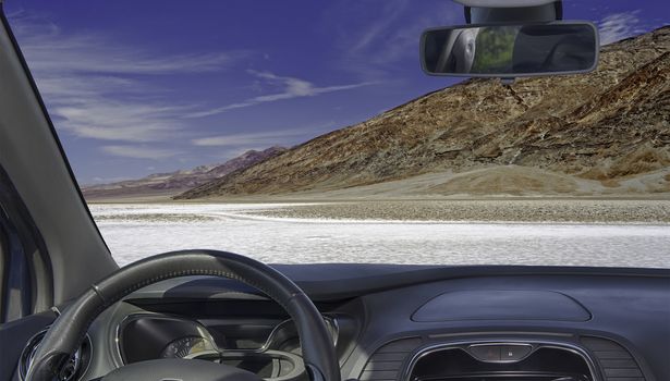 Car windshield with view of Badwater Basin, Death Valley, USA