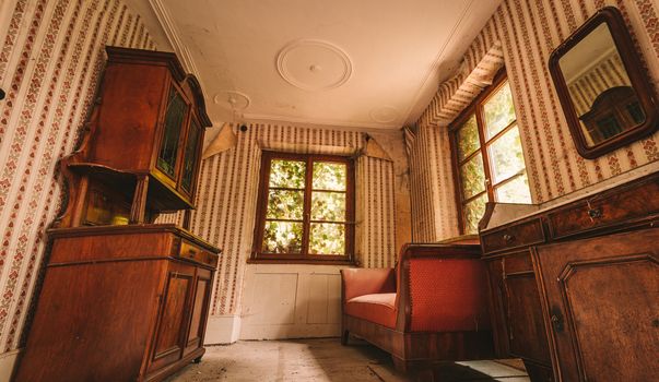 An old abandoned manor house with antique furniture and wonderful architecture