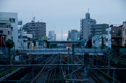 Morning sun rise scene of Tokyo metropolis and complex train tra