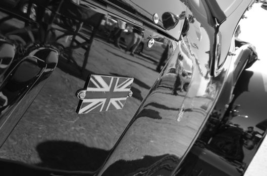 United Kingdom National Union Jack logo on classical car in blac