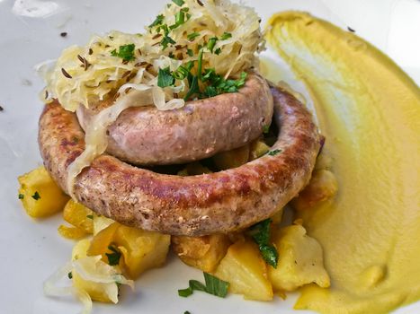 Traditional German grilled bratwurst sausages with mustard sauce