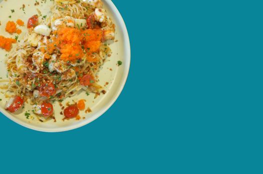 fusion food style , Cream sauce spaghetti egg shrimp on blue background