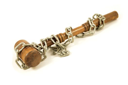 An isolated over white background chain wrapped wood gavel for concepts related to law bindings and company policies.