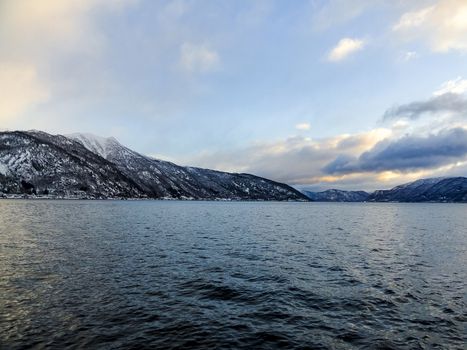 Winter landscape fjord sunrise sunset, Norway. Ferry Vangsnes to Balestrand.