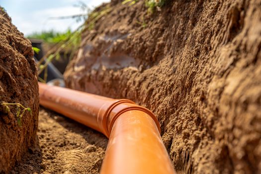 plastic pipes in the ground for wastewater and rainwater