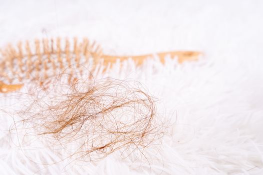 Hair fall problem, closeup comb and problem hair. Healthcare medical or daily life concept.