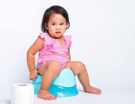 little cute baby child girl education training to sitting on blu
