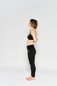 Yoga asana sport woman fitness light background leggings model. High quality photo