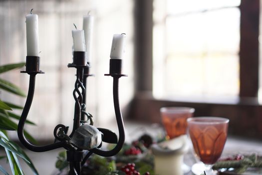 Forged metal candlestick with candles