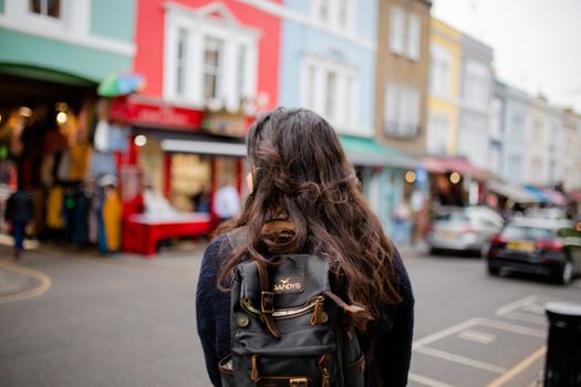 Woman Standing in Front of a Blurry British Neighbourhood