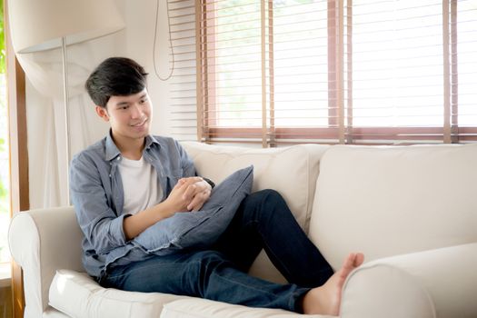 Portrait young handsome asian man napping relax with cozy on sof