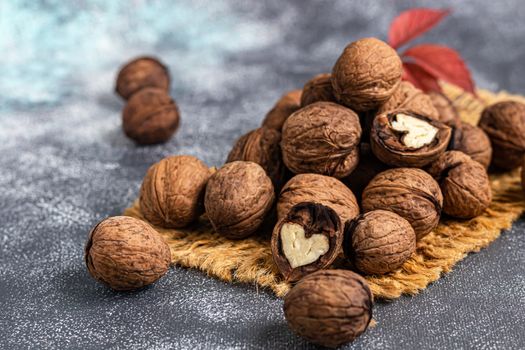 Walnuts. Contains beneficial vitamins and minerals. On a gray background.