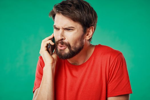 Man with mobile phone wrinkled face problems at work