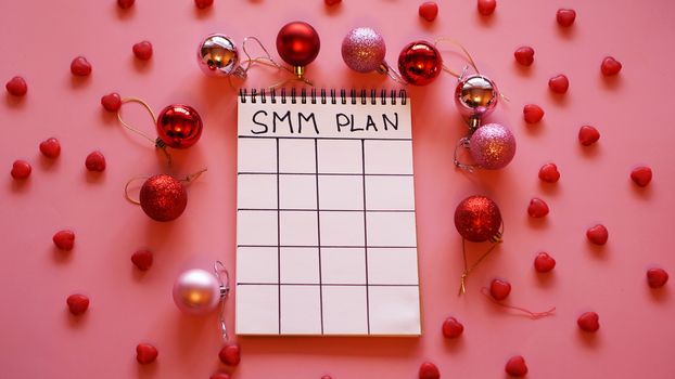 Freelance project. SMM plan blank. White sheet on a pink festive background
