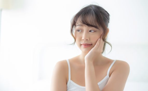 Portrait of beautiful young asian woman smile while wake up heal