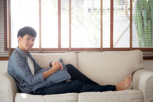 Portrait young handsome asian man napping relax with cozy on sof
