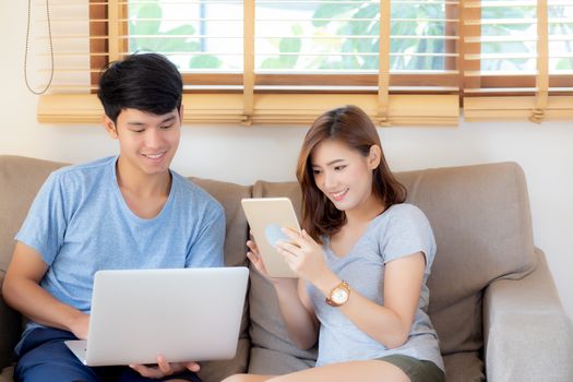 Beautiful young asian couple cheerful freelance working with man