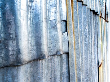 Rusty corrugated galvanized sheet iron fence