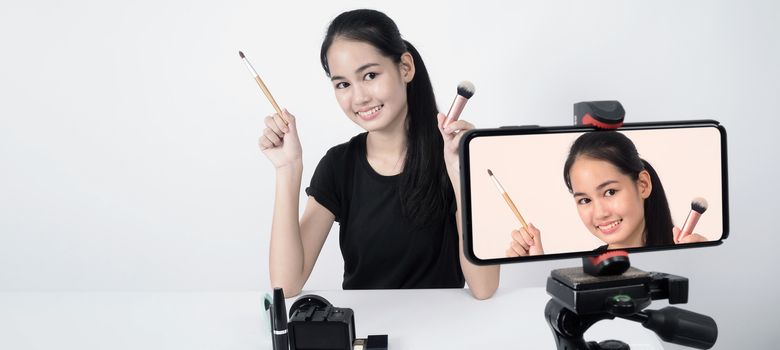 Asian teen woman sit in front of camera and live broadcasting