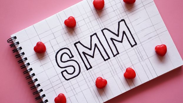 SMM Social media marketing text on on notebook