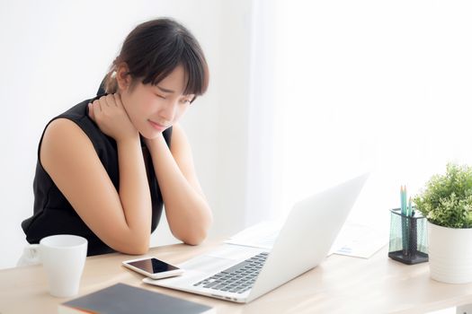 Business woman overwork on laptop computer and neck pain with at