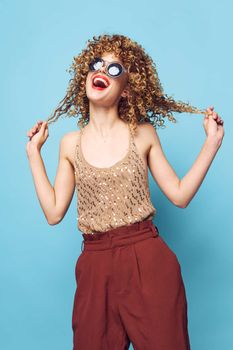 woman Curly hair held by hands joy lifestyle sunglasses fashion decoration