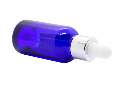 Blue glass dropper serum bottle on white background, Mockup for cosmetic product design