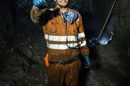 Miner smiling inside the mine