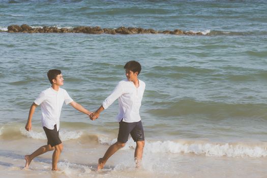 Homosexual portrait young asian couple running with cheerful tog