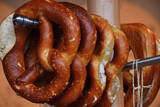Close up pretzel bread hanging on retail display