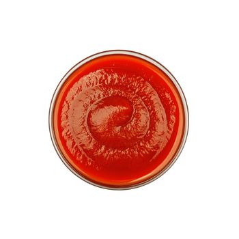 Glass bowl of tomato ketchup isolated on white