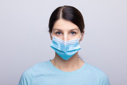 Worried nurse, doctor or scientist portrait behind face mask and protective facemask stock photo