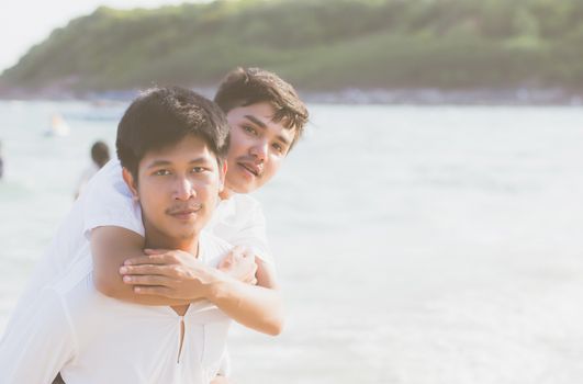 Homosexual portrait young asian couple riding the neck together 