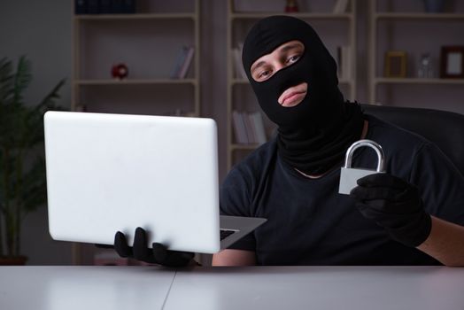 Hacker hacking computer late at night