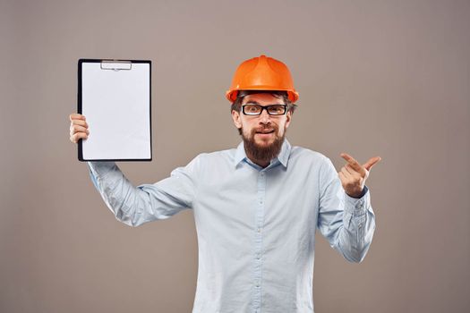 Worker man orange hard hat construction industry manual