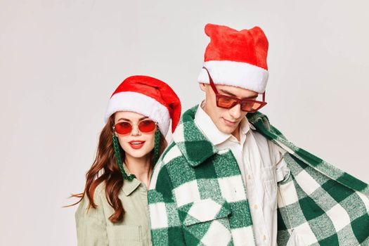 Man and woman New Years Style Holiday studio close-up sunglasses