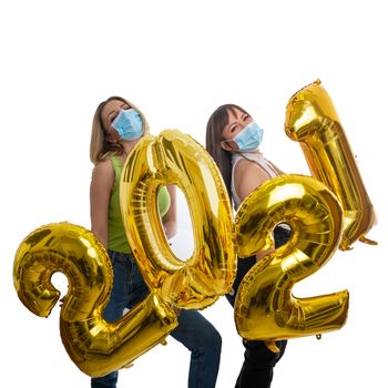 Girls celebrate the New Year 2021 with face masks