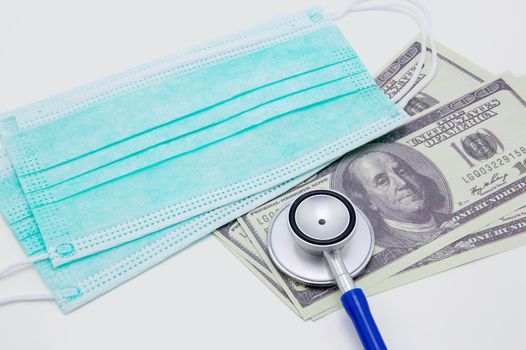 Stethoscope on dollar banknote isolated for care health of business impact from flu covid-19, financial and crisis economic of coronavirus, epidemic and prevention in global recession of finance.